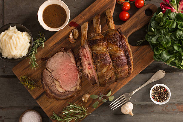 Celebrity Roast Rib eye roast with side dish. Rib Roast Vs Prime Rib stock pictures, royalty-free photos & images