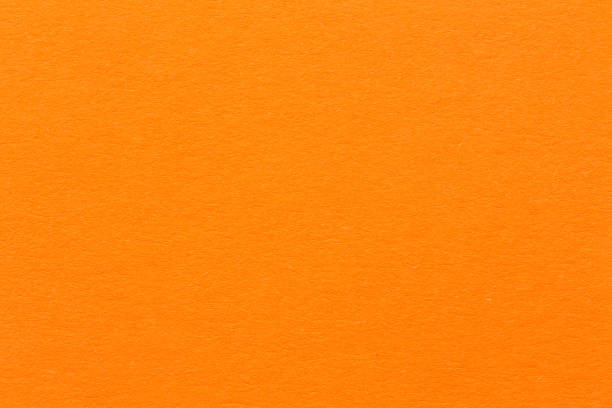 zement hellen orange hintergrund - orange farbe stock-fotos und bilder