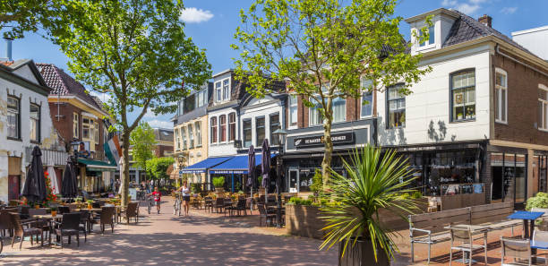 Central shopping street with restaurants and bars in Assen stock photo