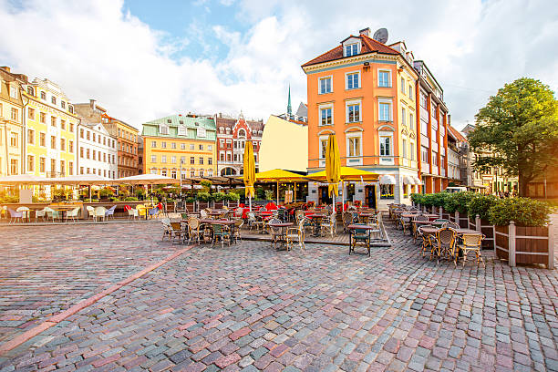 Central square in Riga Dome square with cafes and restaurants in the old town center in Riga, Latvia latvia stock pictures, royalty-free photos & images