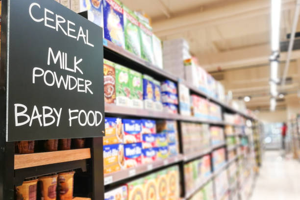 Cereal, milk powder, baby food grocery category aisle at supermarket Cereal, milk powder, baby food signage grocery category aisle at supermarket baby formula stock pictures, royalty-free photos & images