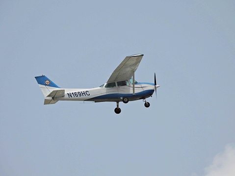 Fort Lauderdale, Broward County, Florida USA, July 4, 2022.  A Cessna fixed wing single engine, 4 seats / 1 engine, N37SE, landing at the Fort Lauderdale Executive Airport.