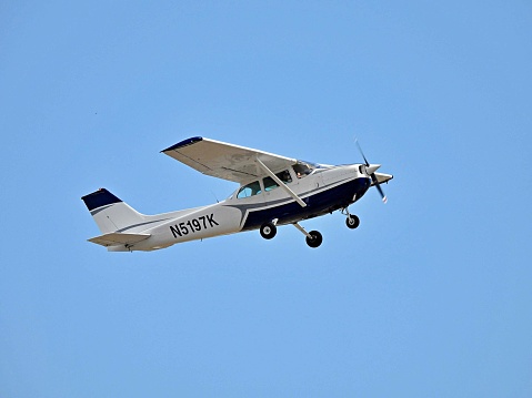 Pompano Beach, Broward County, Florida, USA July 4, 2022. A Cessna fixed wing single engine, 4 seats / 1 engine,  N5197K taking off from the  Pompano Beach Airpark.