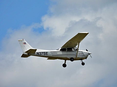 Fort Lauderdale, Broward County, Florida USA, July 4, 2022.  A Cessna fixed wing single engine, 4 seats / 1 engine, N6034B, landing at the Fort Lauderdale Executive Airport.