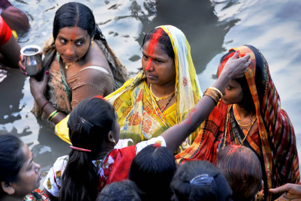 chaath puja festival of india Married Hindu women receive sindoor or vermillion on fore head as a part of ritual during Chhath puja.Chhath Puja is an ancient Hindu festival, is dedicated to the Sun and his wife Usha in order to thank them for sustaining life on Earth chhath stock pictures, royalty-free photos & images