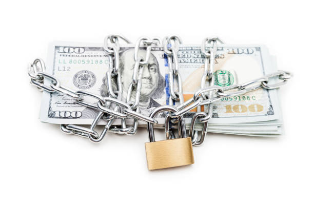 Chain link with padlock on dollar currency money stock photo