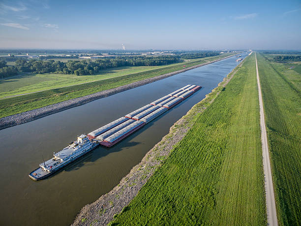 Chain of Rocks Canal barges on Chain of Rocks Canal of Mississippi River above St Louis - aerial view barge stock pictures, royalty-free photos & images