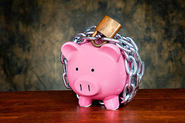 Chained piggybank stock photo