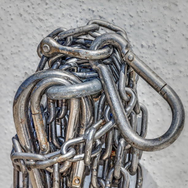 Chains Chains hanging on a wall linkage effect stock pictures, royalty-free photos & images