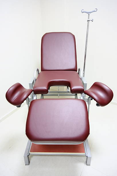 Chair in a gynecologists room Chair in a gynecologists room. stirrup stock pictures, royalty-free photos & images