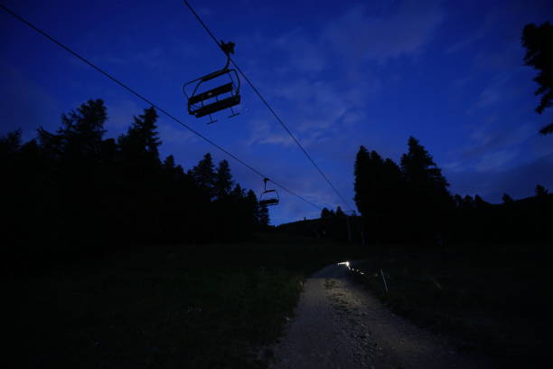 Chair lift at night in Sauze d’oulx piedmont Italy stock photo