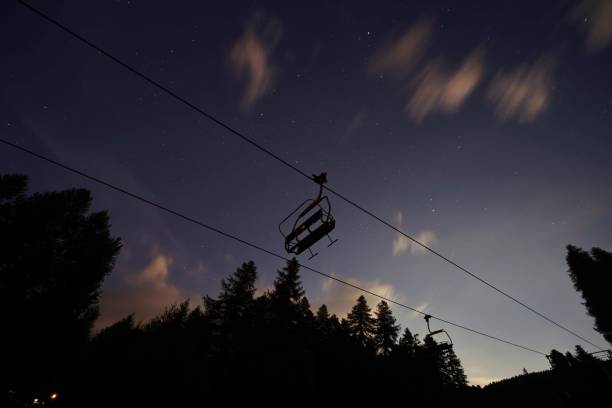 Chair lift at night in Sauze d’oulx piedmont Italy stock photo