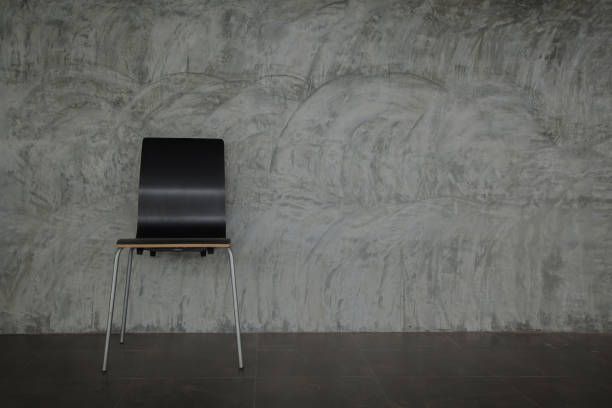 chair on Loft wall background of a gray concrete  fair faced concrete stock pictures, royalty-free photos & images