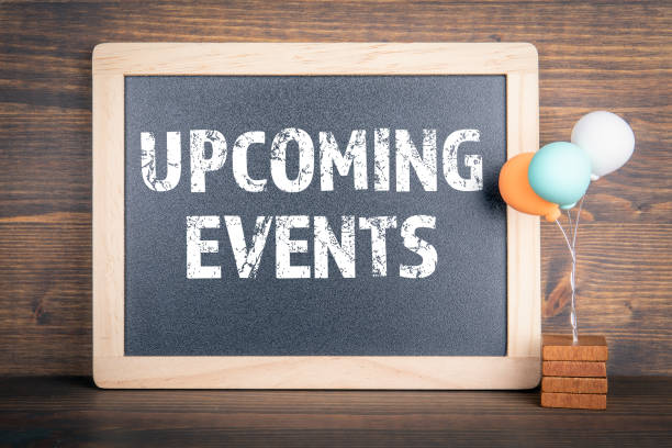 UPCOMING EVENTS. Chalkboard and colored balloons on a wooden background UPCOMING EVENTS. Chalkboard and colored balloons on a wooden background. entertainment event stock pictures, royalty-free photos & images