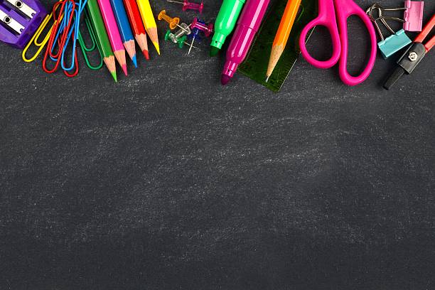 Chalkboard with school supplies top border School supplies top border on a chalkboard background school supplies stock pictures, royalty-free photos & images