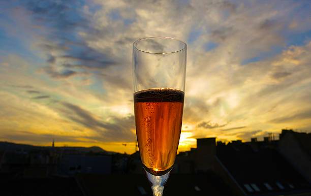 Champagne cocktail with sunset background stock photo