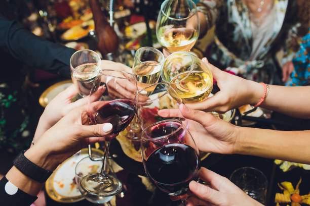 Champagne glasses in hands of people at party. stock photo