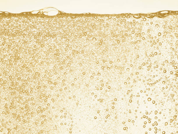 シャンパンゴールドバブル - 炭酸 ストックフォトと画像