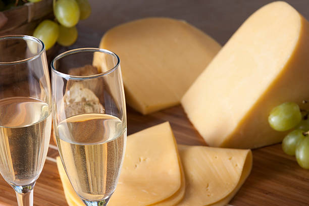 champagne, grapes and cheese stock photo