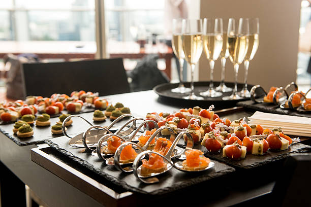 Champagne reception Reception drinks and luxury canapé indoors. appetizer stock pictures, royalty-free photos & images
