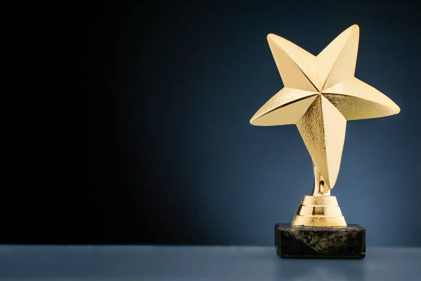 Championship or race trophy with a gold star stock photo