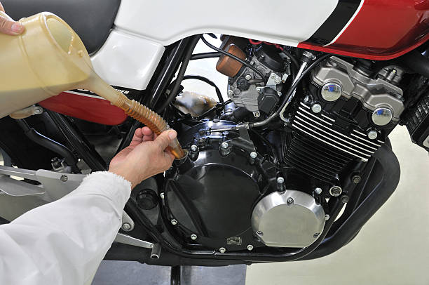 Change oil of motorcycle stock photo