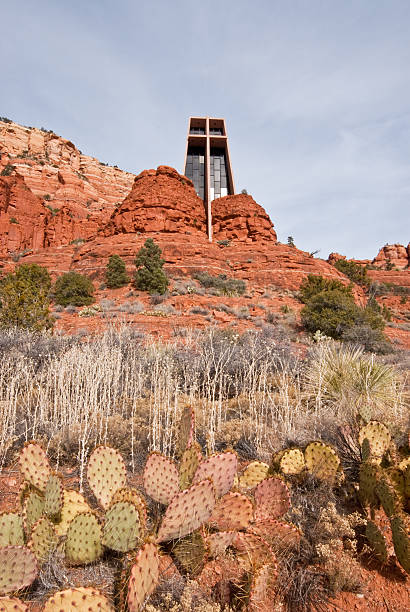 Chapel of the Holy Cross The Chapel of the Holy Cross is a Roman Catholic church built into one of the many red rock buttes of Northern Arizona. The chapel was inspired and commissioned by a local rancher and sculptor Marguerite Brunswig Staude. The chapel was built in 1956, with a special-use permit, on Coconino National Forest land. The permit was obtained with the help of the late Senator Barry Goldwater. In 2007, Arizonans voted to list the Chapel as one of the Seven Man-Made Wonders of Arizona. The Chapel of the Holy Cross is in Sedona, Arizona, USA. jeff goulden church stock pictures, royalty-free photos & images