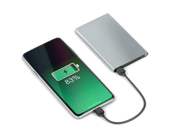 Charging the smartphone with a power bank Charging the smartphone with external battery battery photos stock pictures, royalty-free photos & images