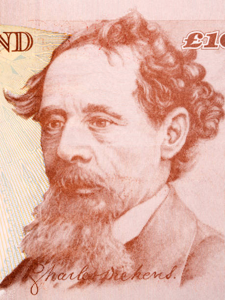 Charles Dickens a portrait from old English money stock photo