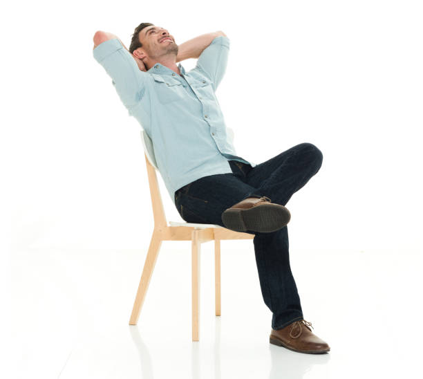 Charming man seated realxing stock photo
