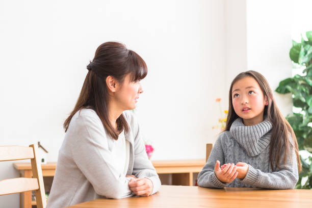 Chat family Chat family asian mother talking with daughter stock pictures, royalty-free photos & images