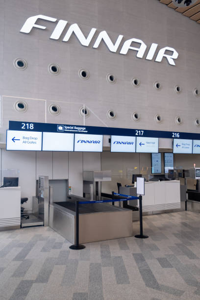 Check-in counter for the Finnish flag carrier Finnair at Helsinki-Vantaa airport. stock photo