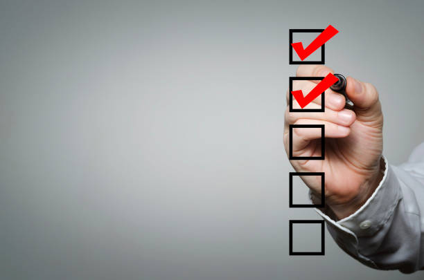 Checklist Blank checklist on the whiteboard with businessman hand drawing a red check mark in the check box aspirations stock pictures, royalty-free photos & images