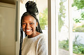 istock Cheerful african teenage girl coming in her house 1333647263