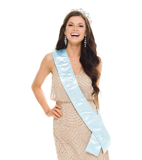 Cheerful beauty queen looking at camera Cheerful beauty queen looking at camerahttp://www.twodozendesign.info/i/1.png beauty pageant stock pictures, royalty-free photos & images