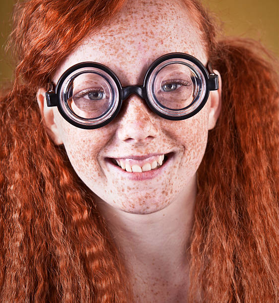 Cheerful freckled nerdy girl freckled nerdy girl and red hair ugly girl stock pictures, royalty-free photos & images
