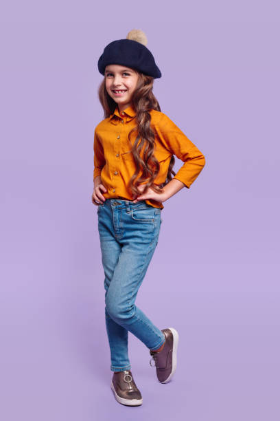 Cheerful girl in trendy casual outfit and beret stock photo