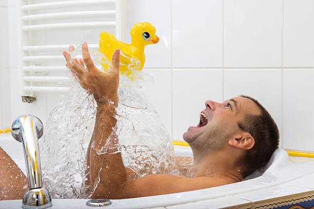 cheerful-man-in-bathtub-picture-id500172