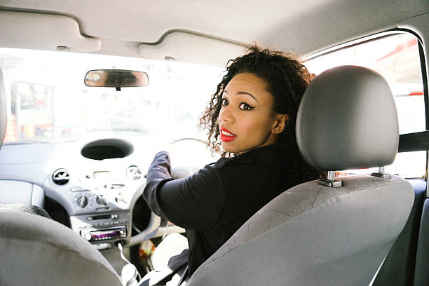 Cheerful Woman Driving Car stock photo