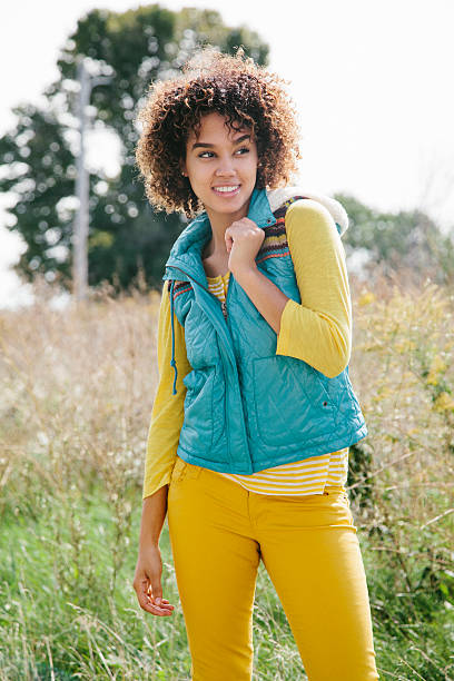 Cheerful woman wearing warm clothing Cheerful college student wearing warm clothing. Back to school hot puerto rican woman stock pictures, royalty-free photos & images