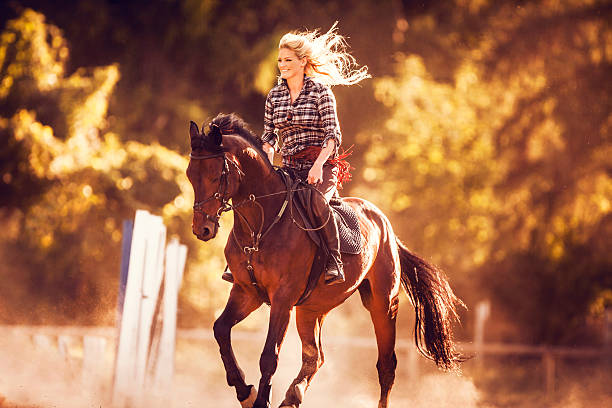 cheerful young woman ridding horse. - smiling earth horse bildbanksfoton och bilder