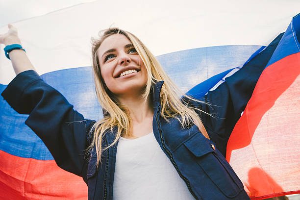 Cheering Woman Under Russian Flag stock photo