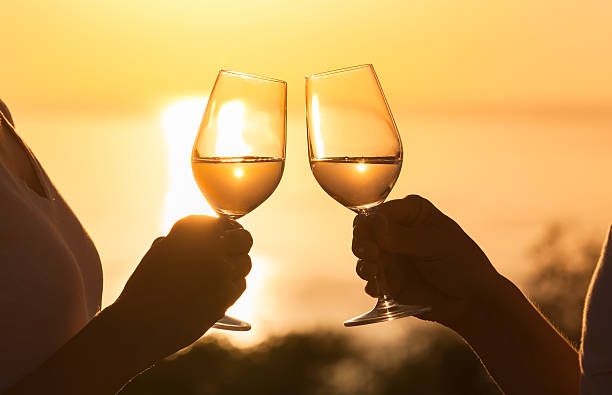 cheers! - sunset dining stockfoto's en -beelden