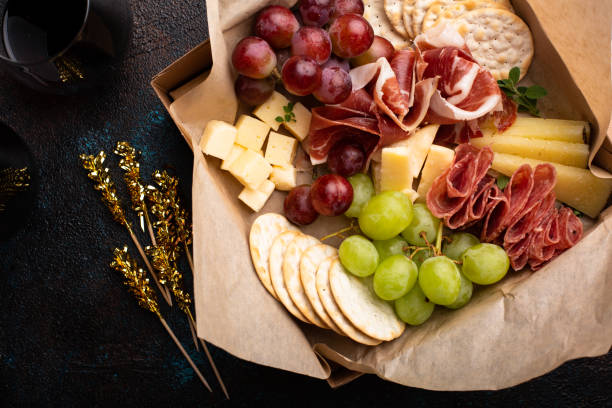 Cheese and meat assortment in a to go box stock photo