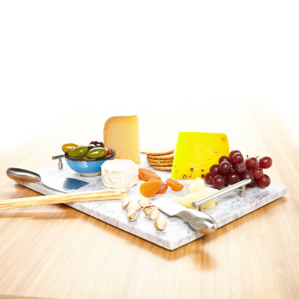 Cheese board with various appetizers stock photo