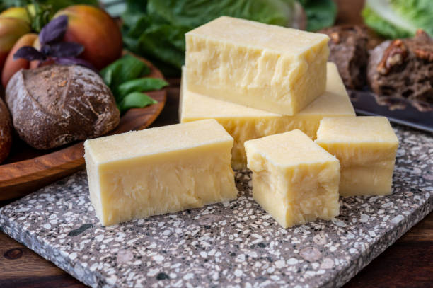 Cheese collection, pieces of aged British cheddar cheese stock photo