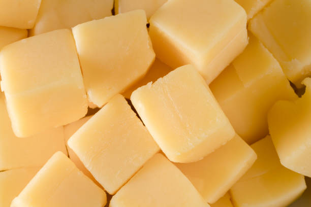 Cheese cubes close-up background stock photo