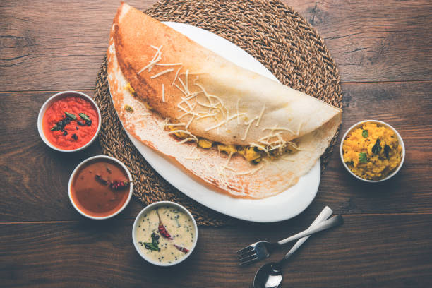cheese masala dosa recipe with sambar and chutney, selective focus cheese masala dosa recipe with sambar and chutney, selective focus thosai stock pictures, royalty-free photos & images
