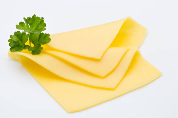 Cheese slices on white background cutout. stock photo