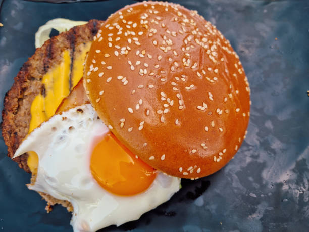 Cheeseburger bread bun with egg and bacon. stock photo